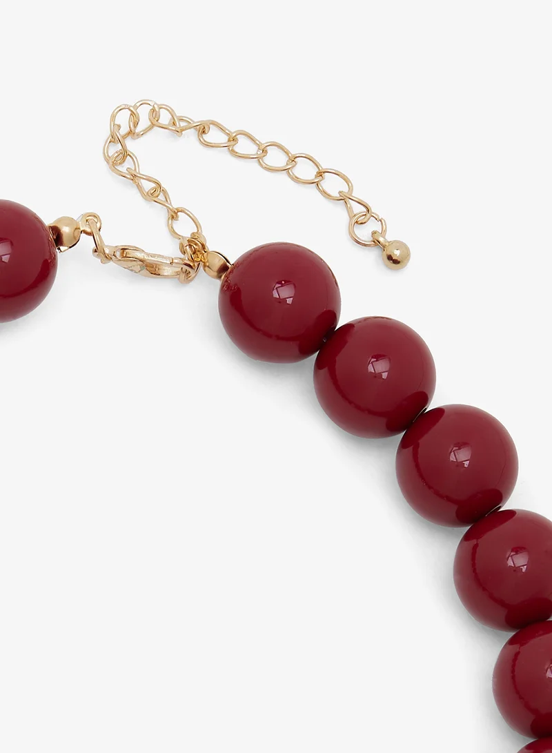 Ella Red Stone Beaded Necklace with Golden Flower Charm for Women | Best Price UAE