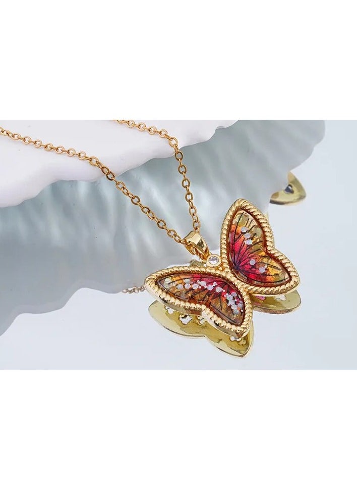 The Black Pearl Accessories - Stainless Steel Necklace Golden with a Zirconic Red Obal Butterfly Pendant - Image 1