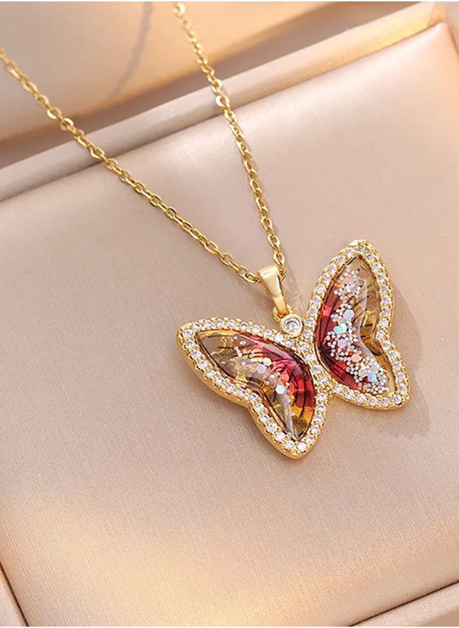 The Black Pearl Accessories - Stainless Steel Necklace Golden with a Zirconic Red Obal Butterfly Pendant - Image 1
