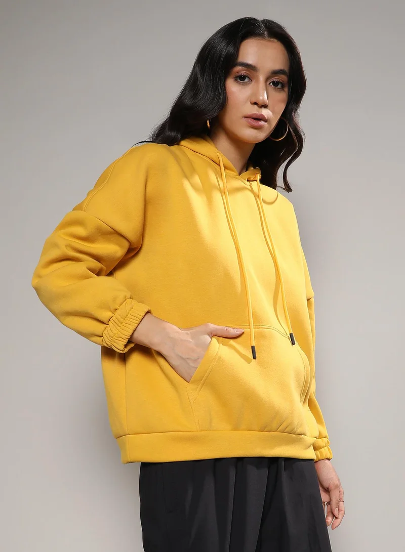 Campus Sutra Women's Mustard Yellow Oversized Basic Hoodie With Kangaroo Pocket
