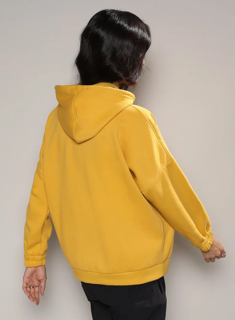 Campus Sutra Women's Mustard Yellow Oversized Basic Hoodie With Kangaroo Pocket