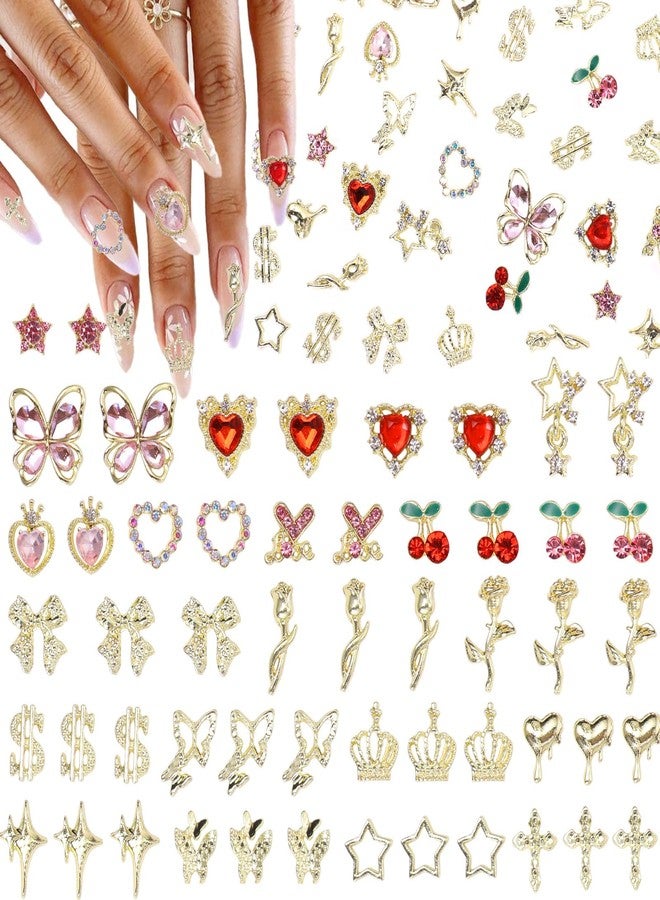 Uotey 130 Pcs Gold Nail Gems and Charms, 3D Metal Star Heart Cherry Butterfly Nail Gem Rhinestone Charms, Assorted Gold Rose Flower Bowtie Crown Dollar Cross Nails Charm for Acrylic Manicure DIY Supplies - Image 1