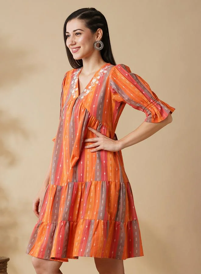 جلو باص فستان مخطط بطول الركبة