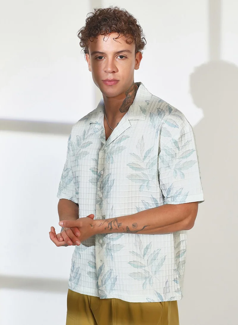 Campus Sutra Campus Sutra Men's Ivory White Faded Foliage Oversized Shirt For Casual Wear | Cuban Collar | Short Sleeve | Button Closure | Oversized Shirt Crafted With Comfort Fit For Everyday Wear