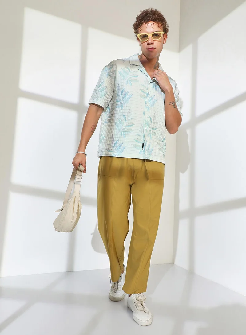 Campus Sutra Campus Sutra Men's Ivory White Faded Foliage Oversized Shirt For Casual Wear | Cuban Collar | Short Sleeve | Button Closure | Oversized Shirt Crafted With Comfort Fit For Everyday Wear