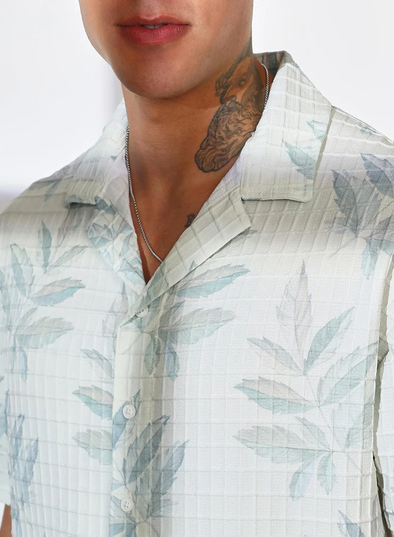 Campus Sutra Campus Sutra Men's Ivory White Faded Foliage Oversized Shirt For Casual Wear | Cuban Collar | Short Sleeve | Button Closure | Oversized Shirt Crafted With Comfort Fit For Everyday Wear