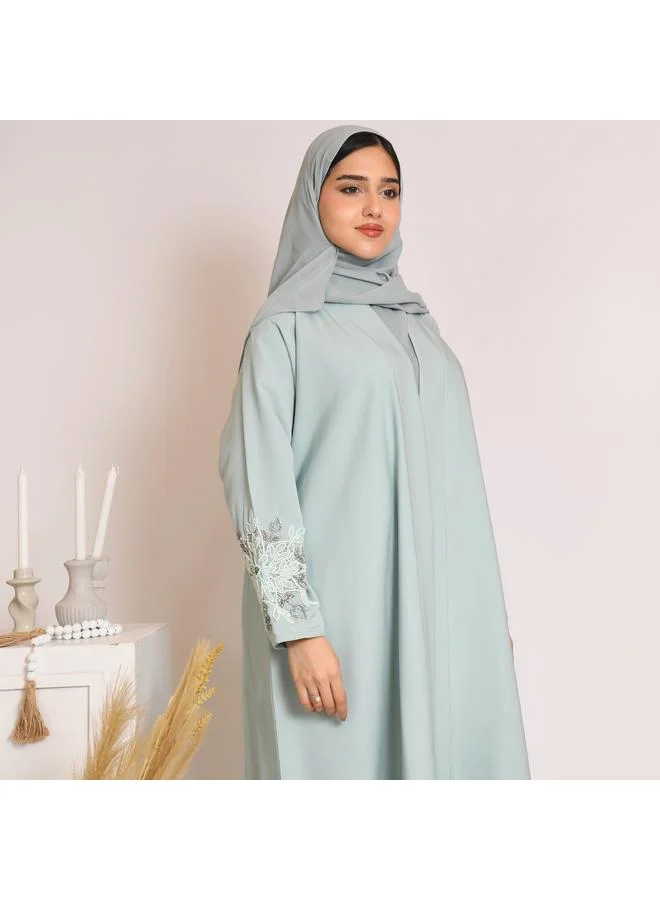 HAWRAA ABAYA Tiffany-colored quarter-cloche wrap abaya with hand embroidery on the sleeves