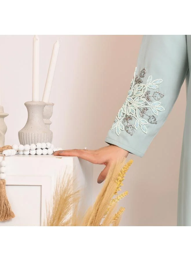 HAWRAA ABAYA Tiffany-colored quarter-cloche wrap abaya with hand embroidery on the sleeves