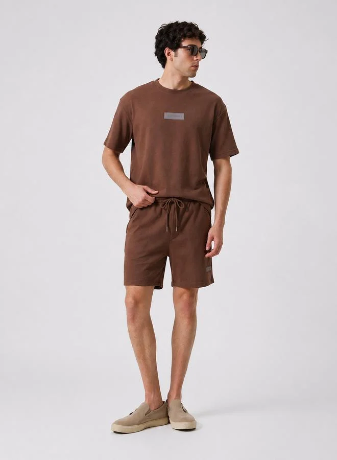 أشيتا فرنانديز Future Oversized Tee in Deep Cocoa Brown