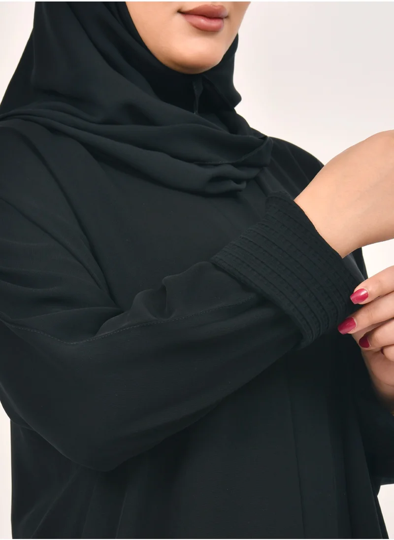 HAWRAA ABAYA Women's abaya closed with crackles, pockets and a pattern on the narrow sleeves in two layers