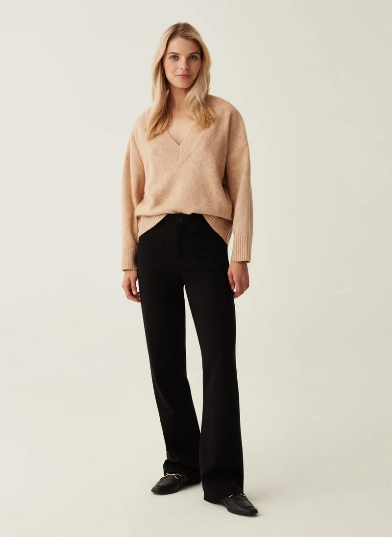 او في اس Flare-fit trousers with pockets