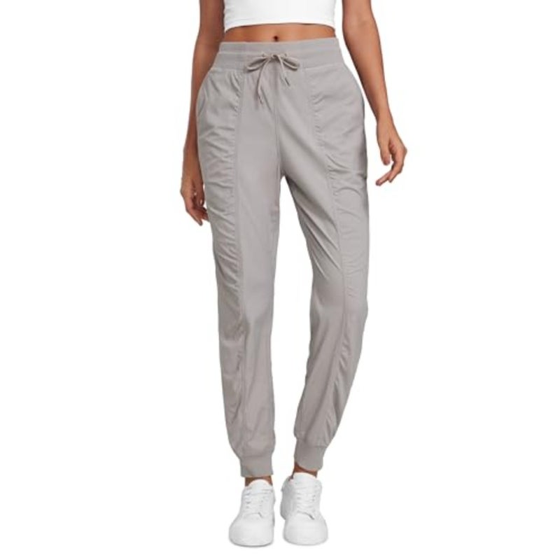 Women's high-waisted joggers for workout studio and casual outdoor use, lightweight polyester-spandex blend, black, ruched design with functional pockets - Image 1