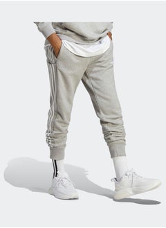 Essentials French Terry Tapered Cuff 3-Stripes Joggers - pzsku/Z632901CAFE1F9AD24A61Z/45/_/1716213372/771ce051-3677-47fc-8494-b9eafcc6cf97