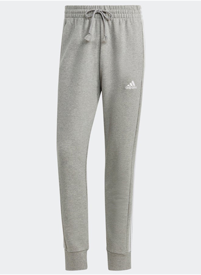 Adidas - بنطال رياضي أساسيات فرينش تيري بأساور مدببة بثلاثة خطوط - Image 1
