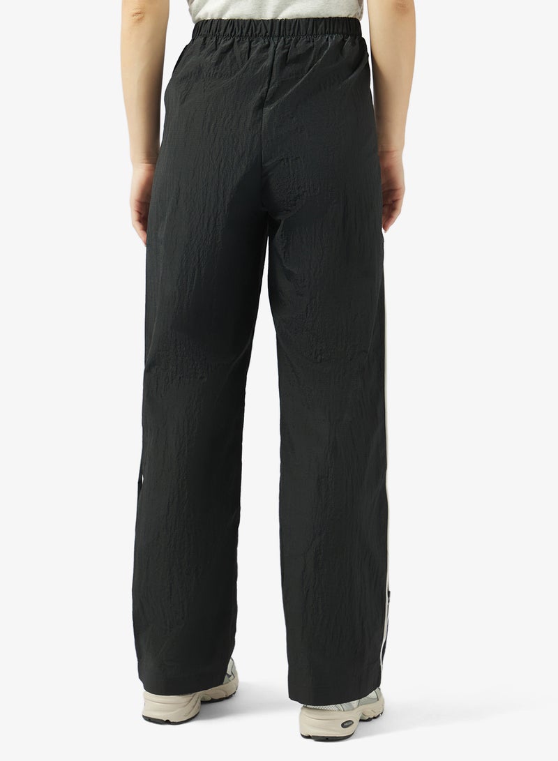 New Balance Essentia Legacy Woven Pants - Image 3