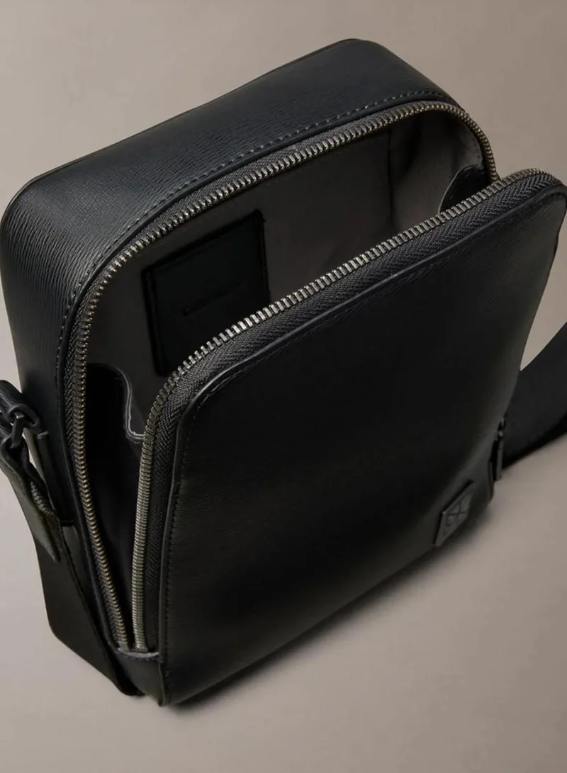 Calvin Klein Black Emblem Logo Textured Reporter Bag for Men | Best Price UAE