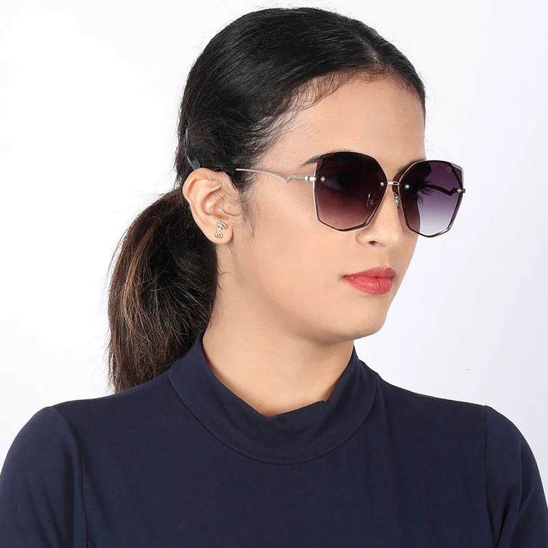 ووجلز نظارة شمسية نسائية أنيقة بحماية من الأشعة فوق البنفسجية، تصميم كبير بدون إطار بلون أسود داكن