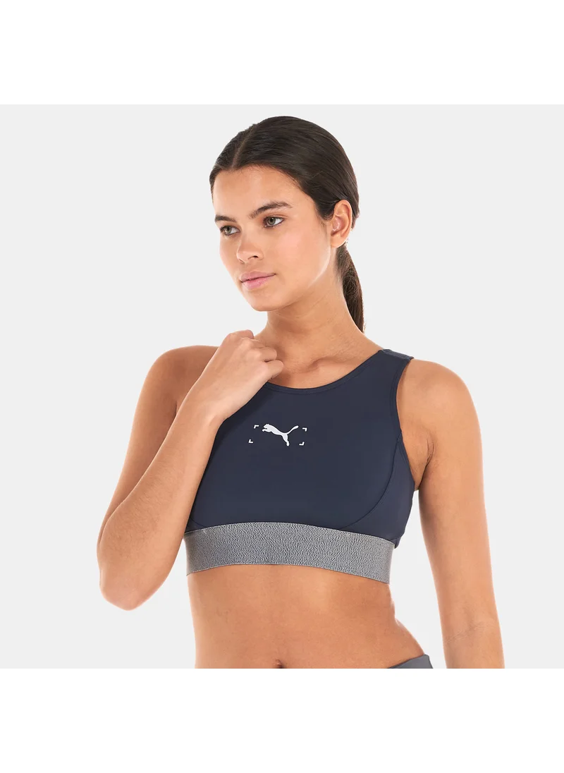 PUMA Women's RE:Collection Mid Impact Sports Bra