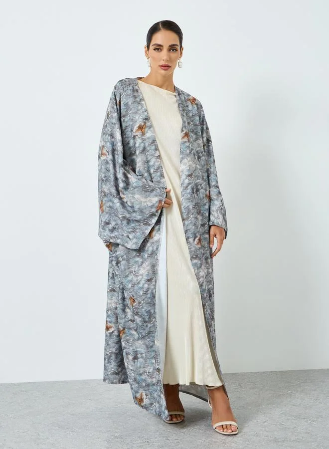 تايك تو عباية بأكمام خفاش وطبعة جرافيك