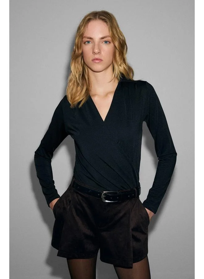 GRIMELANGE MIEL Women's Cuffed Cross-Collar Gathered Long Sleeve Stretch Fabric Snap-Button Black Blouse.