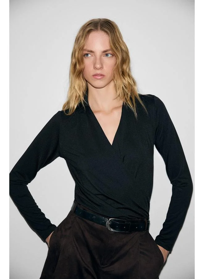 GRIMELANGE MIEL Women's Cuffed Cross-Collar Gathered Long Sleeve Stretch Fabric Snap-Button Black Blouse.
