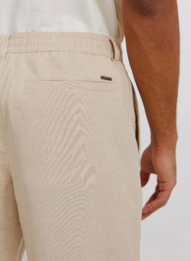 Springfield  Linen/cotton trousers with side seam pockets. It has an elasticated waistband at the back and an internal drawstring for a better fit. Back welt pockets. Straight fit. for Men | Best Price UAE