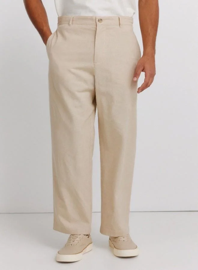 Springfield  Linen/cotton trousers with side seam pockets. It has an elasticated waistband at the back and an internal drawstring for a better fit. Back welt pockets. Straight fit. for Men | Best Price UAE