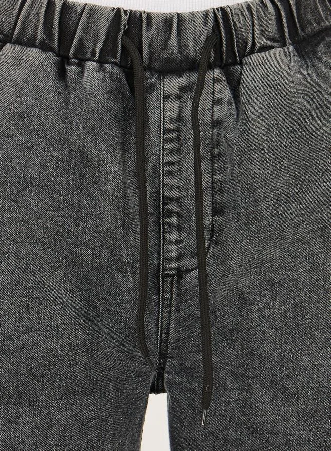 Styli High Rise Elasticated Waist Wide Leg Jeans with Frayed Hem