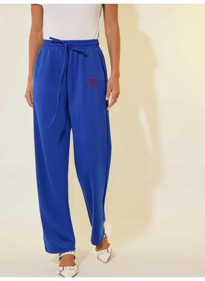 تايك تو Take Two Embroidered Detail Wide Leg Joggers with Drawstring Waist