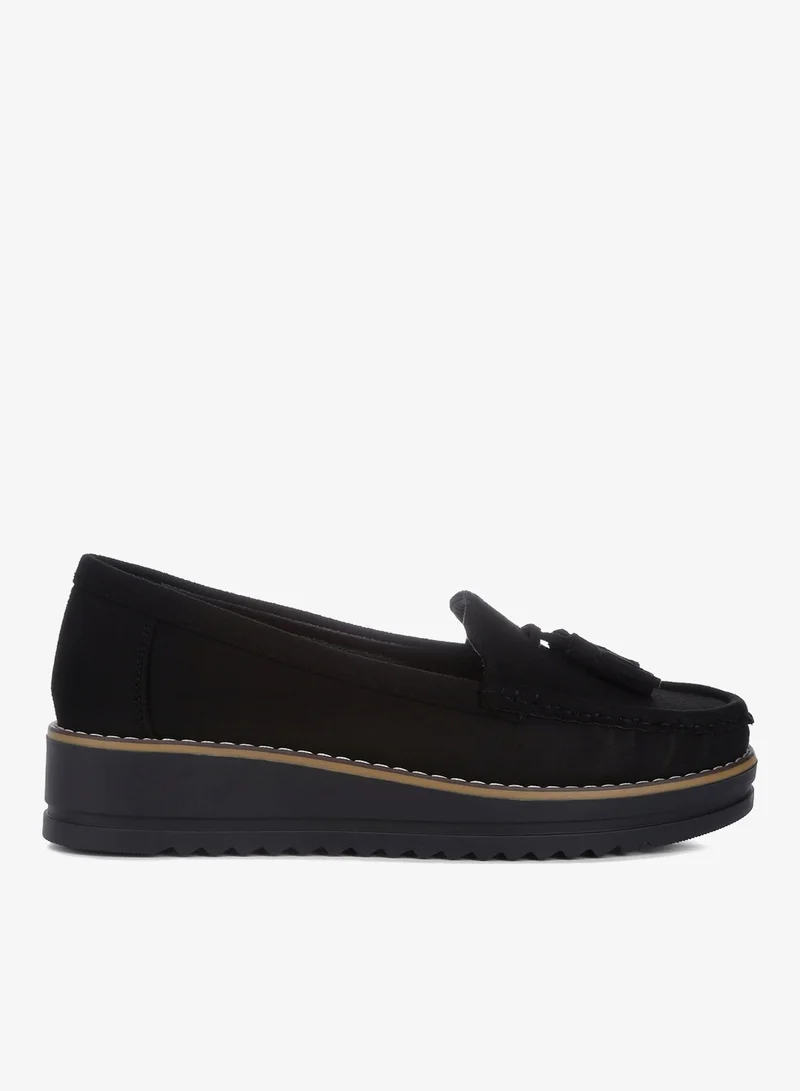 Daiki Platform Lug Sole Tassel Loafers In Black