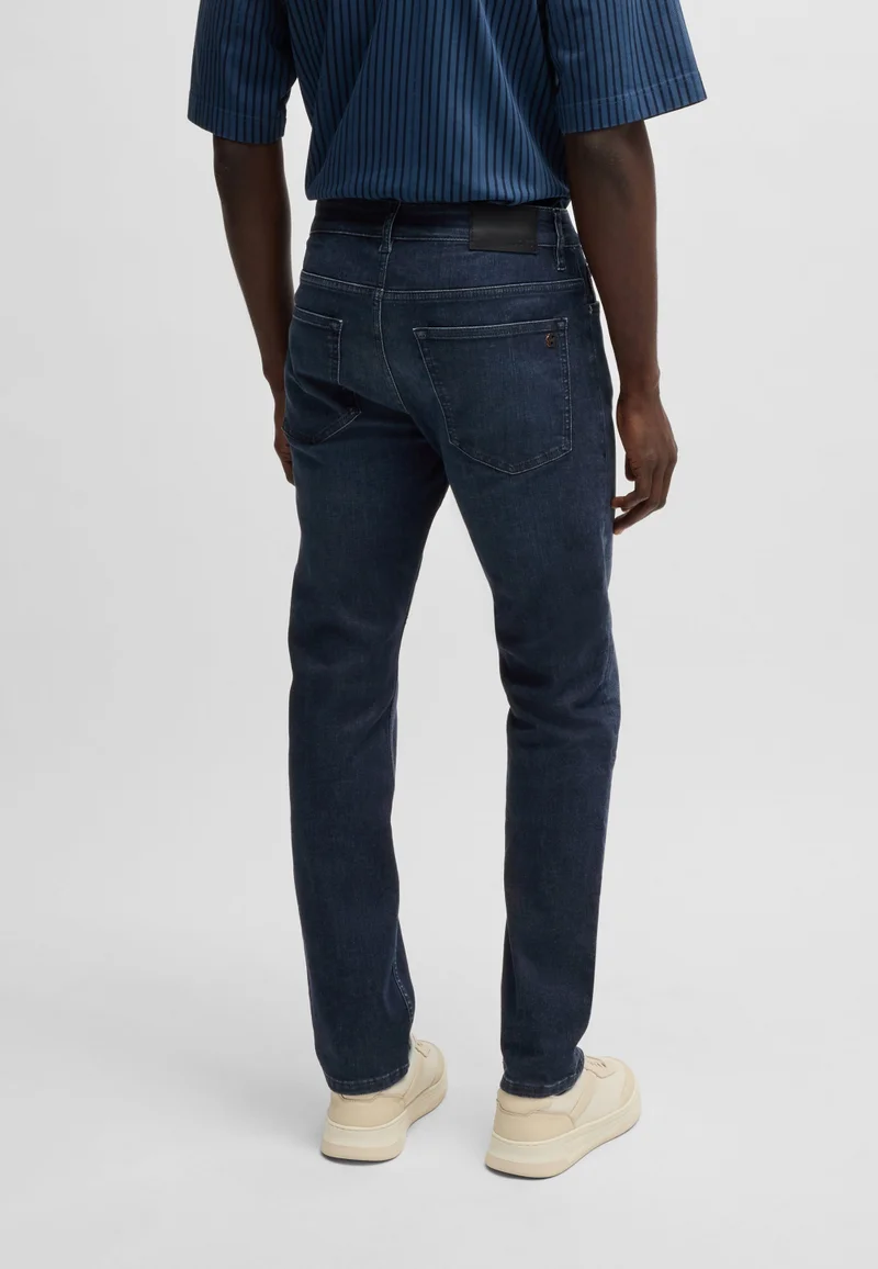 بوس جينز ديلوير بقصة ضيقة من قماش الدنيم الأزرق الداكن