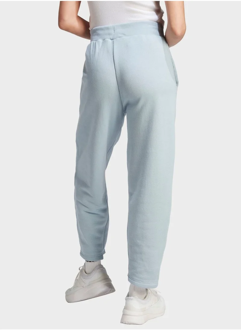 اديداس بنطال بأرجل واسعة Lounge French Terry
