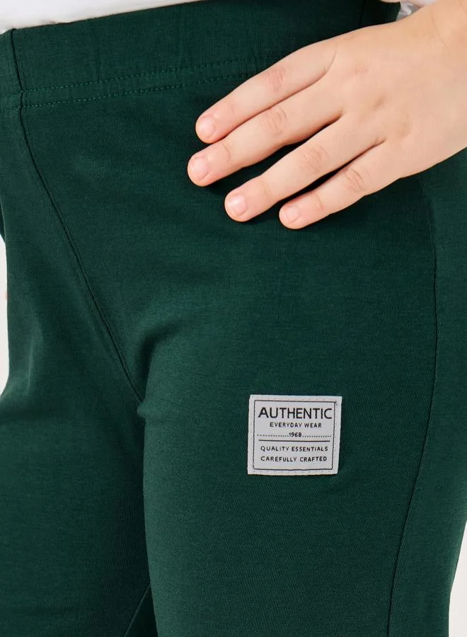 Styli High Rise Flared Legging with Badge