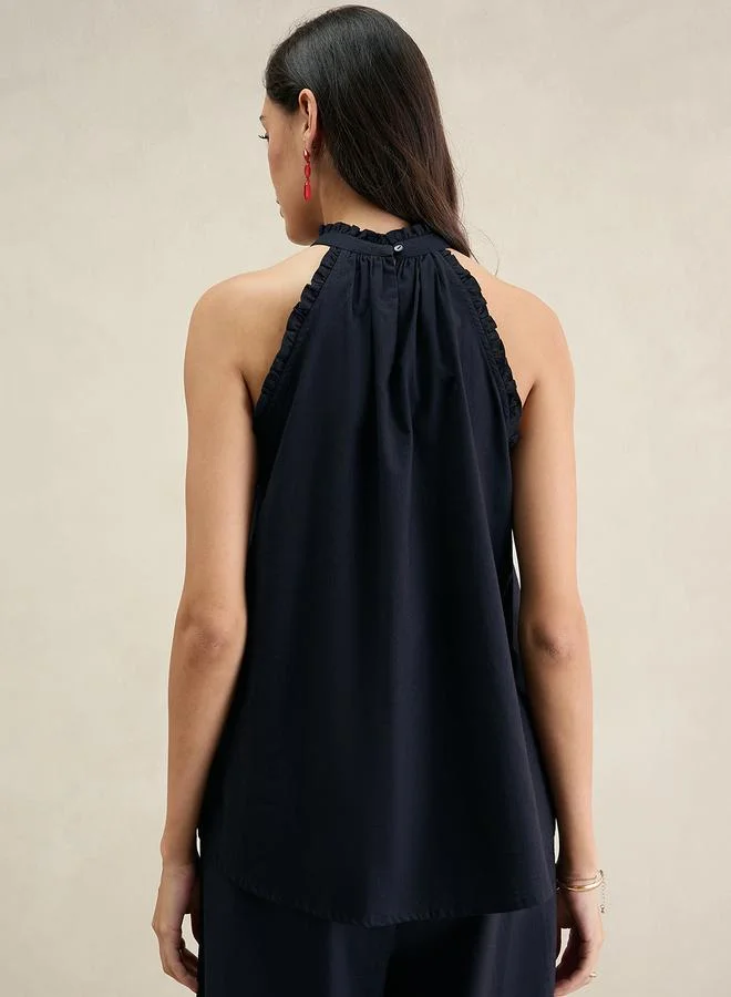 فيميلا بلوزة بياقة مربوطة بلا أكمام