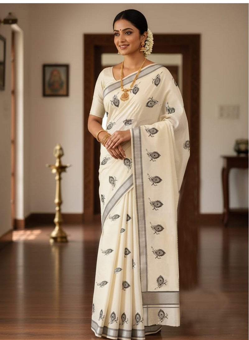 A.M Embroidered Kerala Kasavu saree with a silver border and black peacock motifs - Image 1