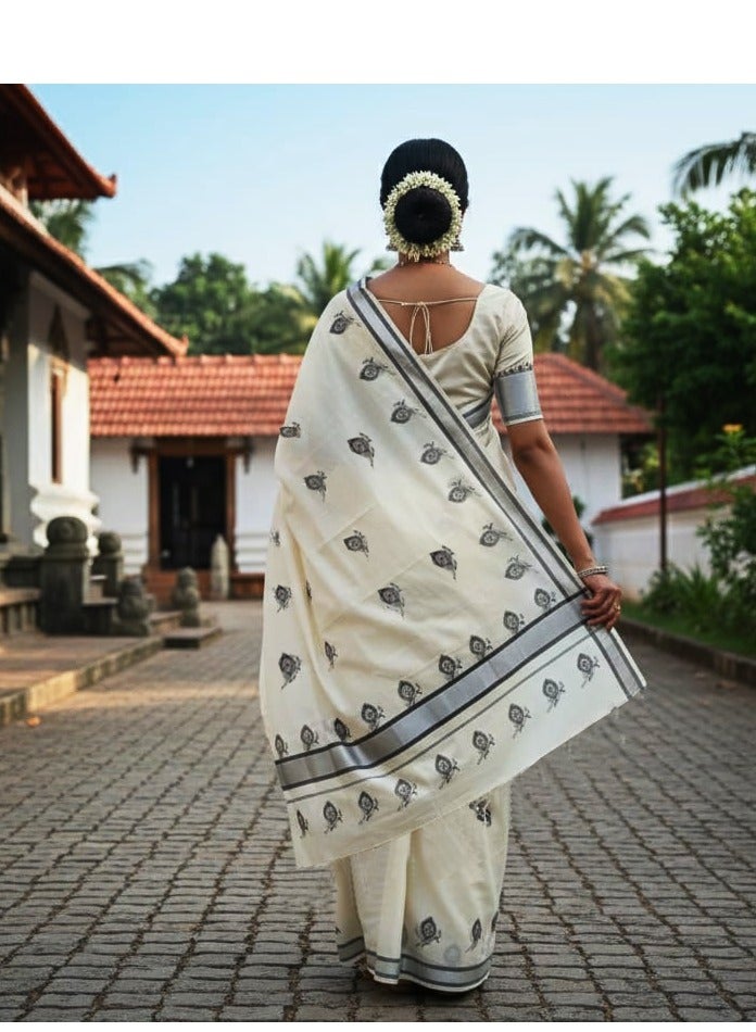 A.M Embroidered Kerala Kasavu saree with a silver border and black peacock motifs - Image 2