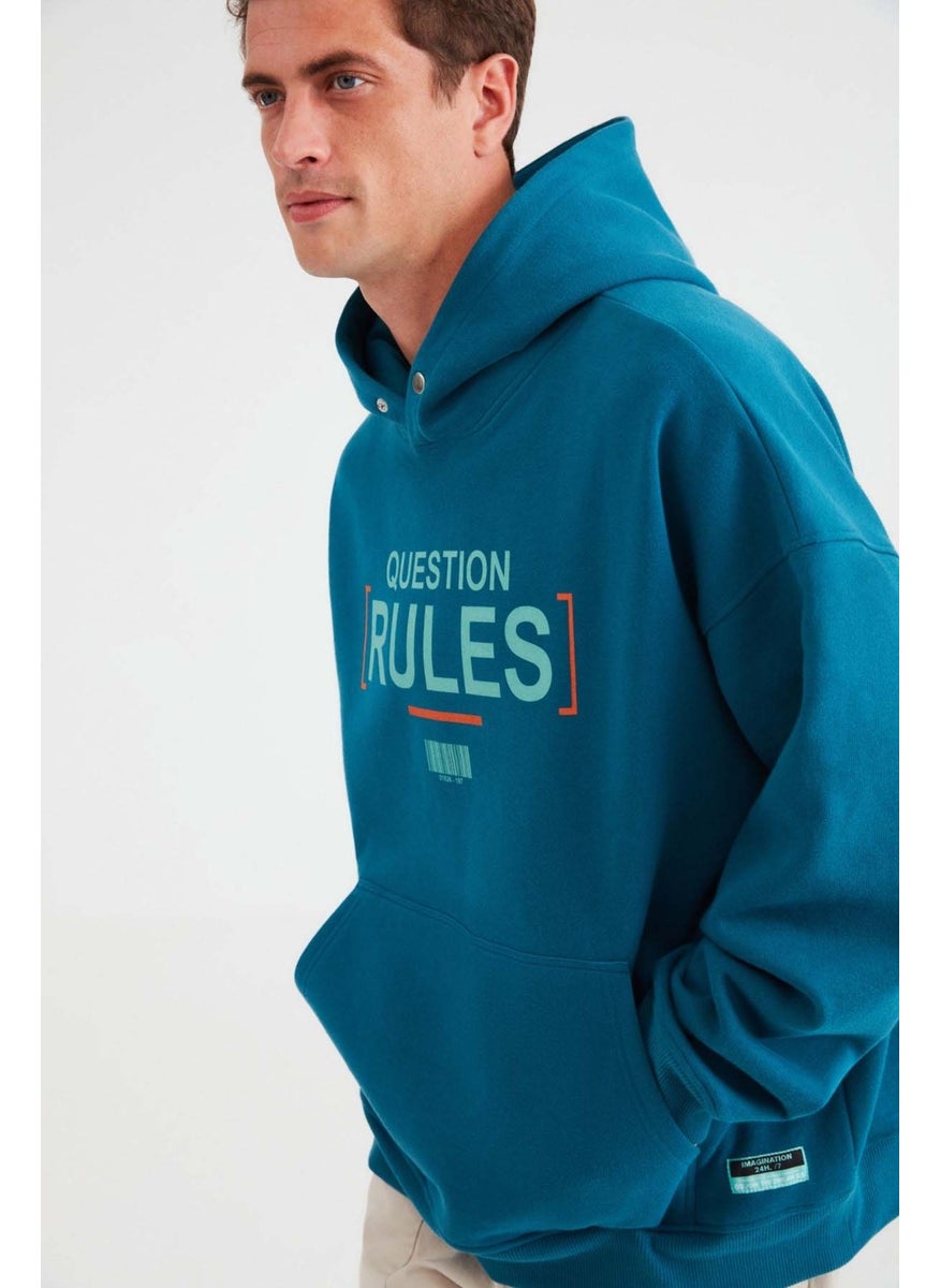 Mood Men's Polar Fleece Text Printed Hooded Sweatshirt in Petrol Green with Snap Buttons on the Collar - pzsku/Z646A5FA2F7E902CEA34BZ/45/_/1741213075/96ad21c9-96d1-4951-b8fc-17da75f399a6