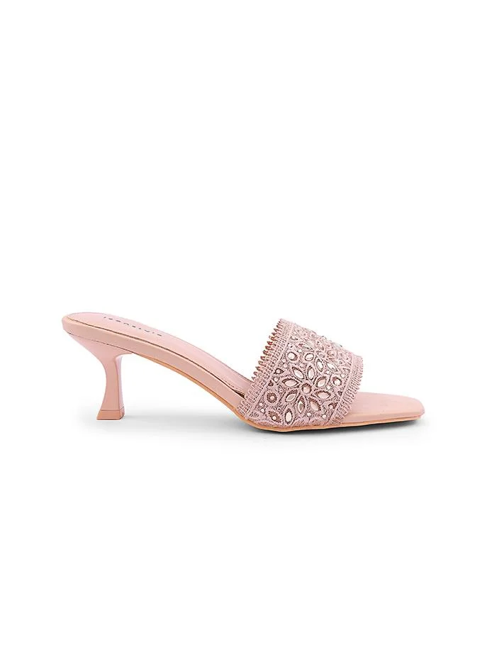 أيقون Elegant heel slipper featuring delicate pearl details.