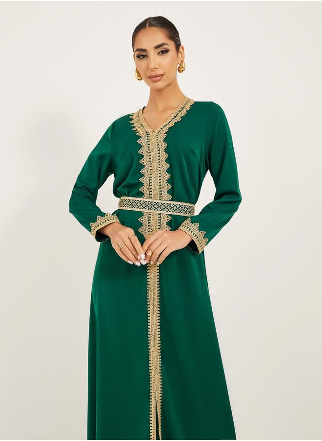 Arabic Kaftan with V neck and gold lace trims at neckline, sleeve hem and centre front along with fabric belt. Lace trim on fabric belt - pzsku/Z64811C1C93BA70CB5448Z/45/1741119908/eaed8964-09e7-4504-8d5c-1a50749536ed