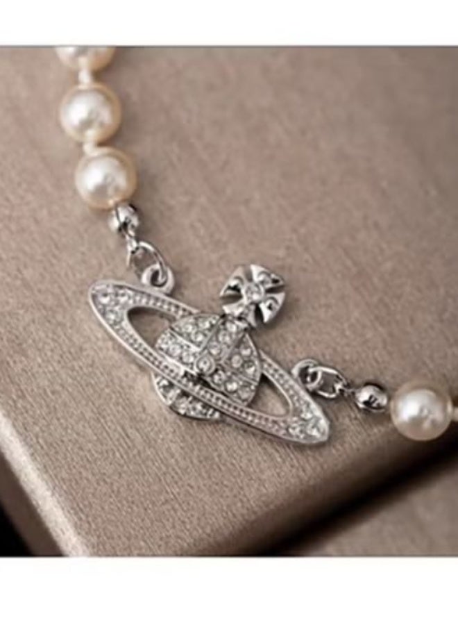Vivienne Westwood Silver Saturn Charm Pearl Bracelet: Crystal-Studded Celestial Jewelry