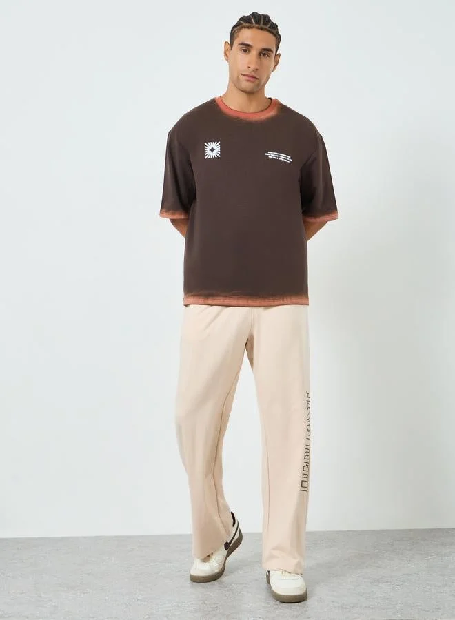 Styli Men Brown Graphic Print Oversized T-Shirt
