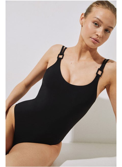 Shaping swimsuit with black washers