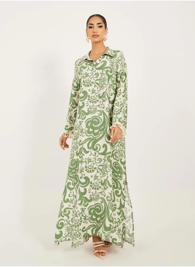 Styli printed soft fabric jalabiya in collar style w/ tassel and shell trim at sleeve hem