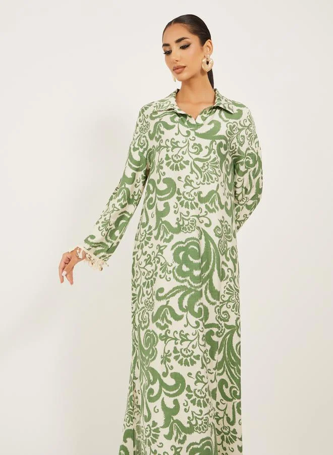 Styli printed soft fabric jalabiya in collar style w/ tassel and shell trim at sleeve hem