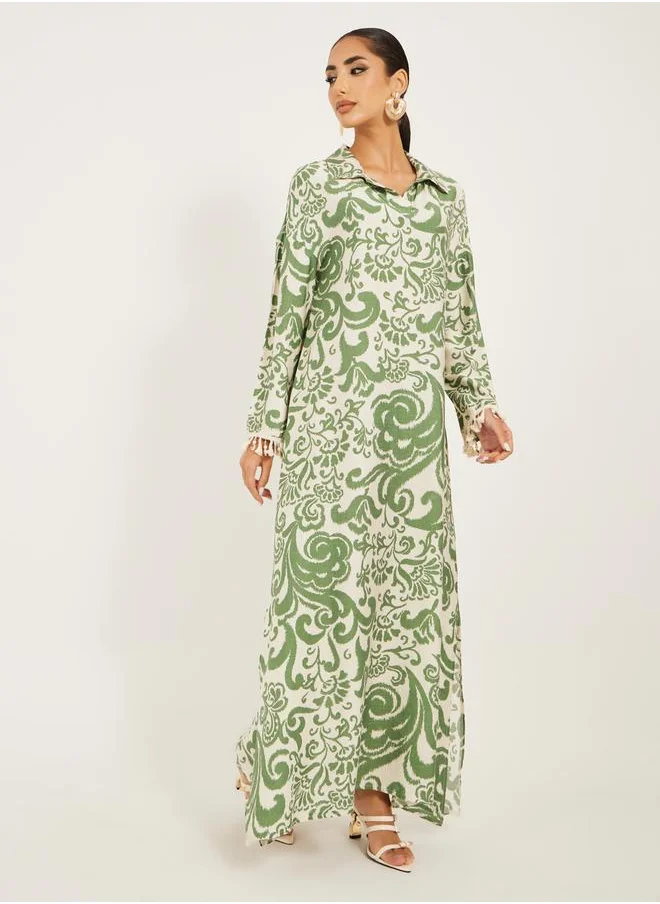 Styli printed soft fabric jalabiya in collar style w/ tassel and shell trim at sleeve hem