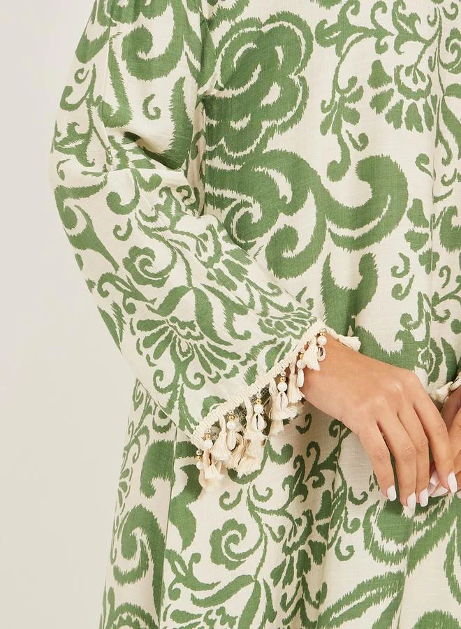 Styli printed soft fabric jalabiya in collar style w/ tassel and shell trim at sleeve hem