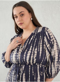 Femmella Plus Size Tie and Dye Print V Neck A-Line Midi Dress by Styli  - Image 4