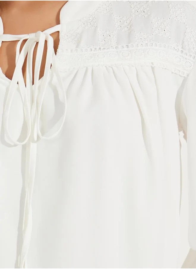 Styli Embroidery Detail Tie-Up Neck Blouse