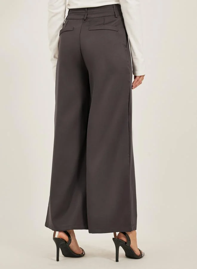 Styli Pleated Wide Leg Pants with Double Buttoned Waistband