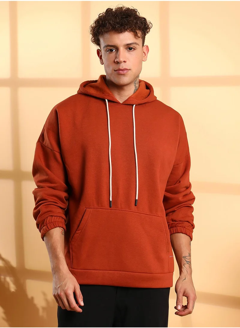 Campus Sutra Men's Burnt Orange Oversized Pullover Sweatshirt With Kangaroo Pocket